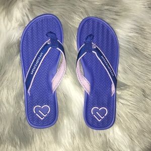 Women’s blue and purple flip flops